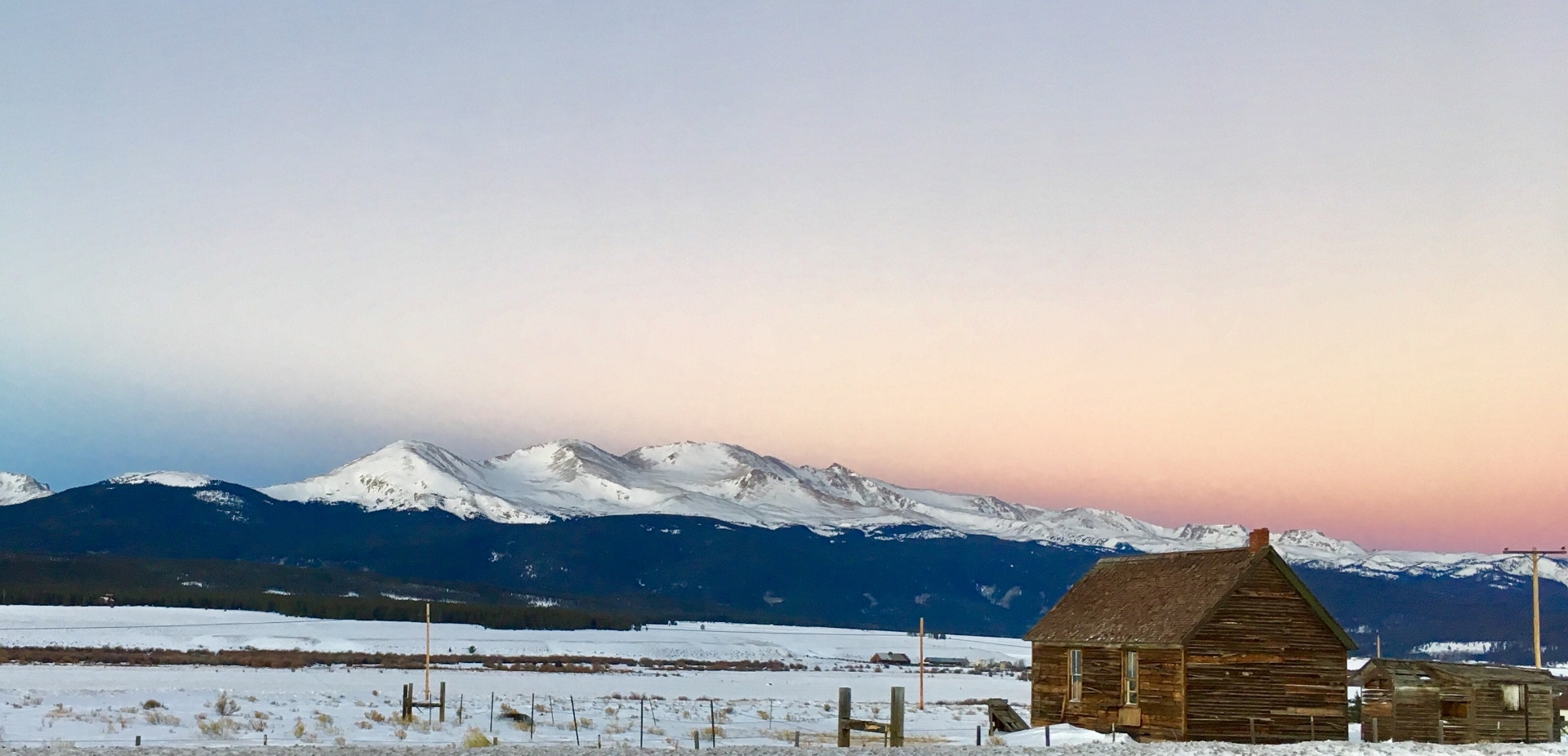 Colorado mountains and cabin at sunrise